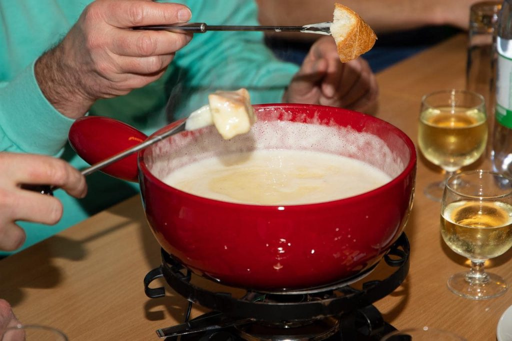 fondue in a red bowl