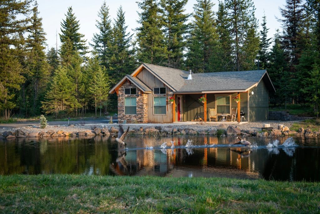 a wooden house on a lake