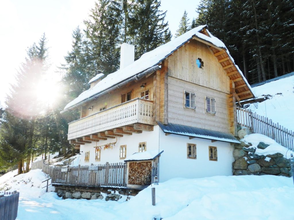 a chalet on a snowy mountain