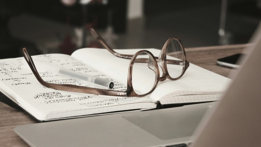 reading glasses on a notebook