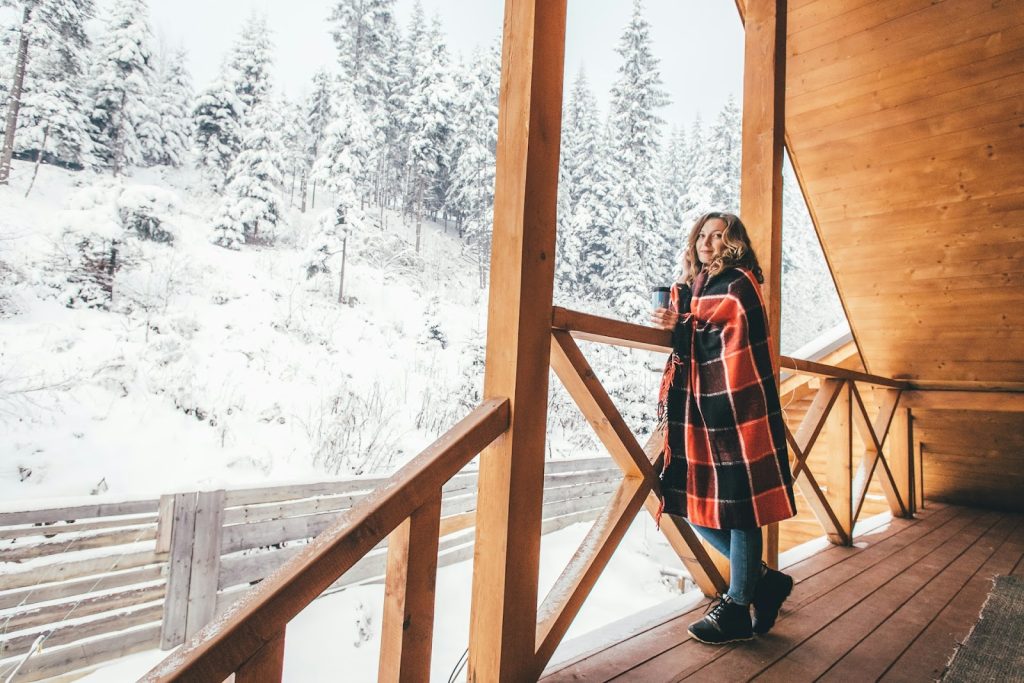 a woman standing on a chalet terrace