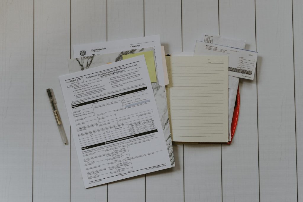 tax documents in a folder on a desk