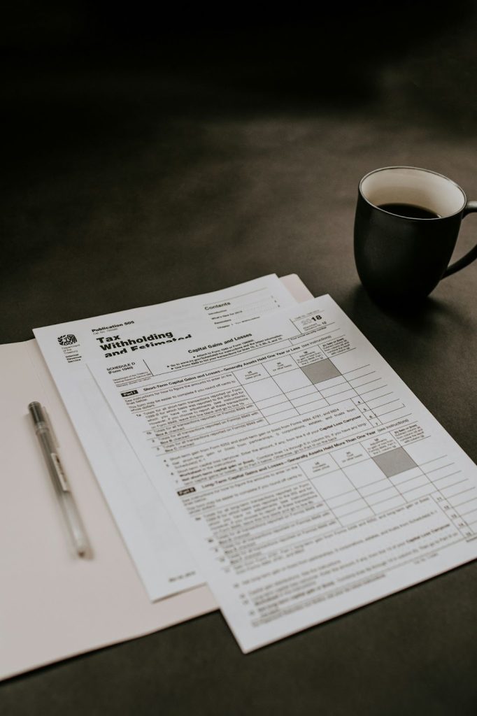 a tax form and a cup of coffee