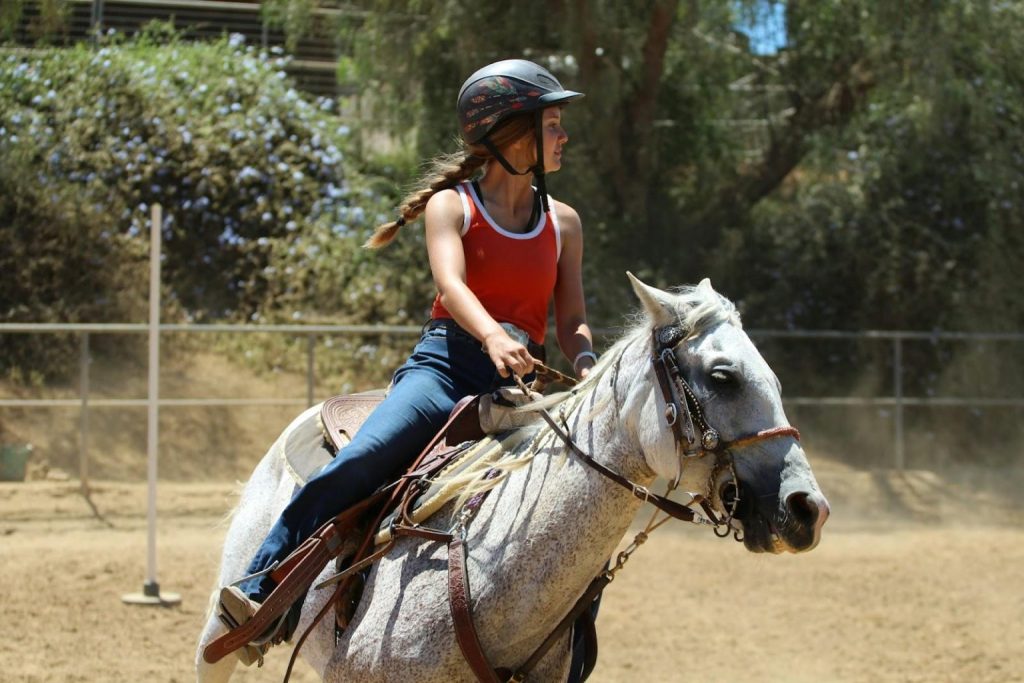 a girl horseback riding